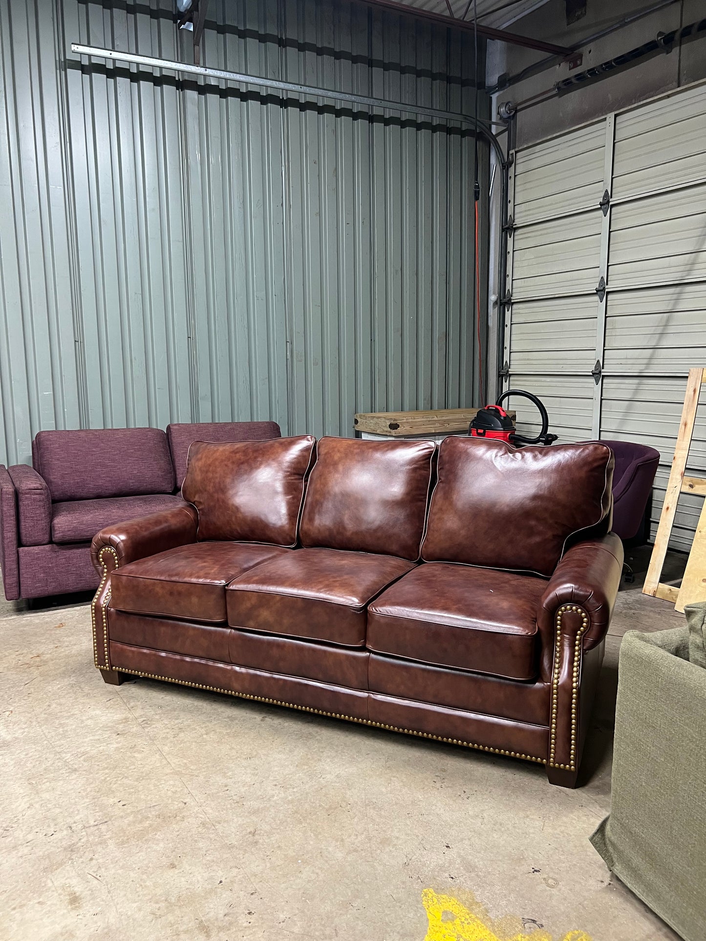 Studded leather pull out bed sofa