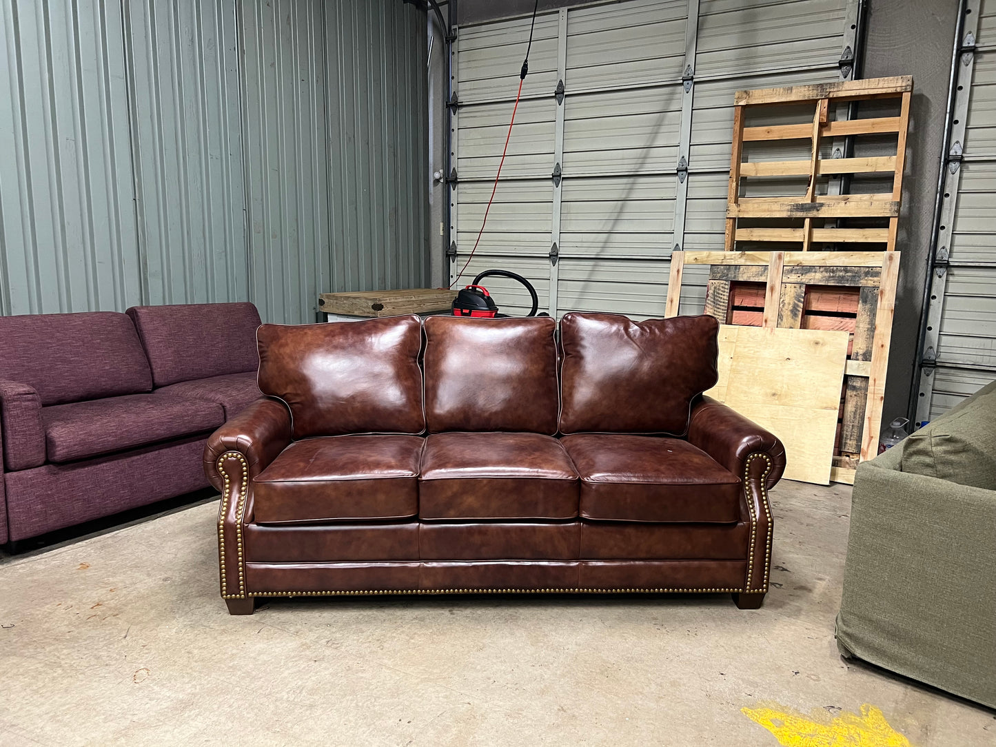 Studded leather pull out bed sofa