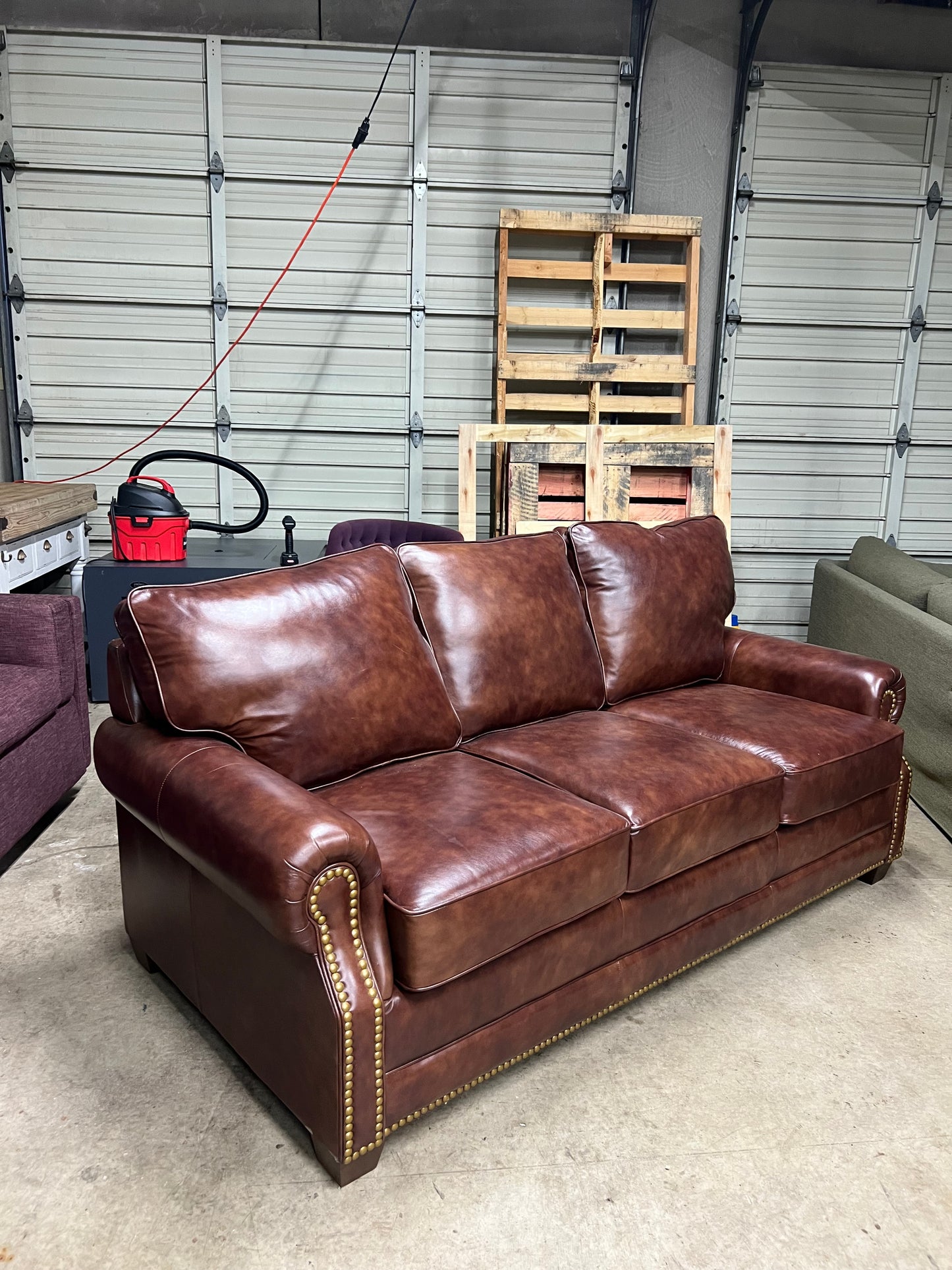 Studded leather pull out bed sofa