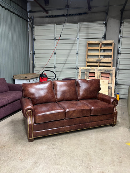 Studded leather pull out bed sofa