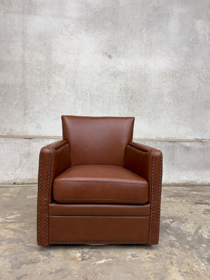 contemporary genuine leather swivel chair with nailhead trim on the arms