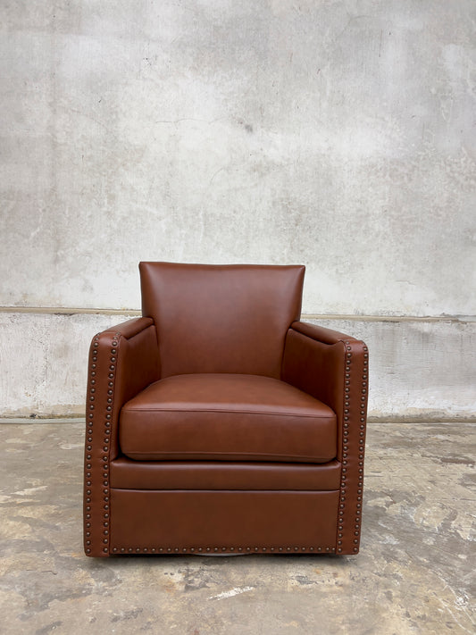 contemporary genuine leather swivel chair with nailhead trim on the arms