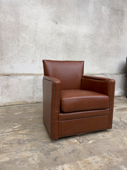 contemporary genuine leather swivel chair with nailhead trim on the arms