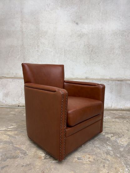 contemporary genuine leather swivel chair with nailhead trim on the arms