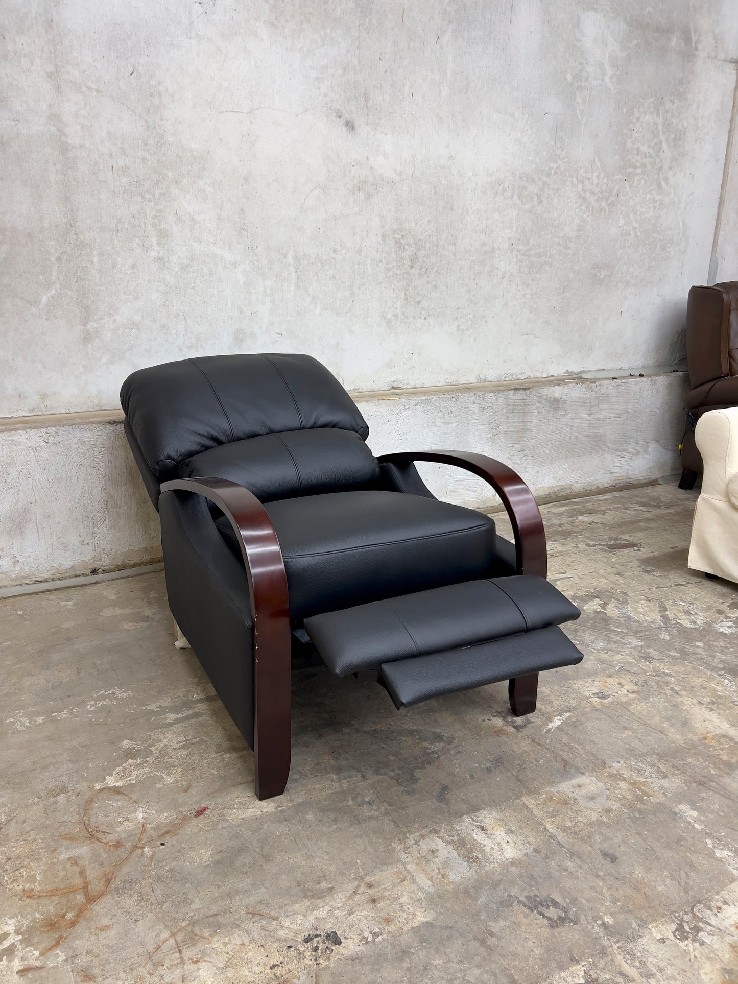 Black Genuine Leather Recliner with Wooden Armrests.