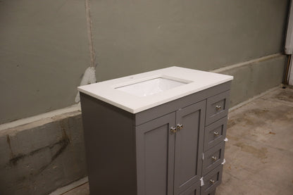 30-inch Gray Bathroom Vanity with a Carrara Quartz Countertop and Undermount Porcelain Sink.