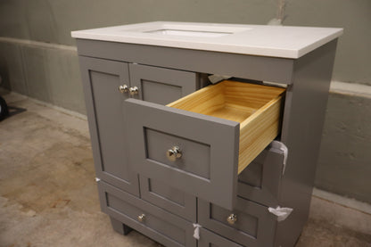 30-inch Gray Bathroom Vanity with a Carrara Quartz Countertop and Undermount Porcelain Sink.
