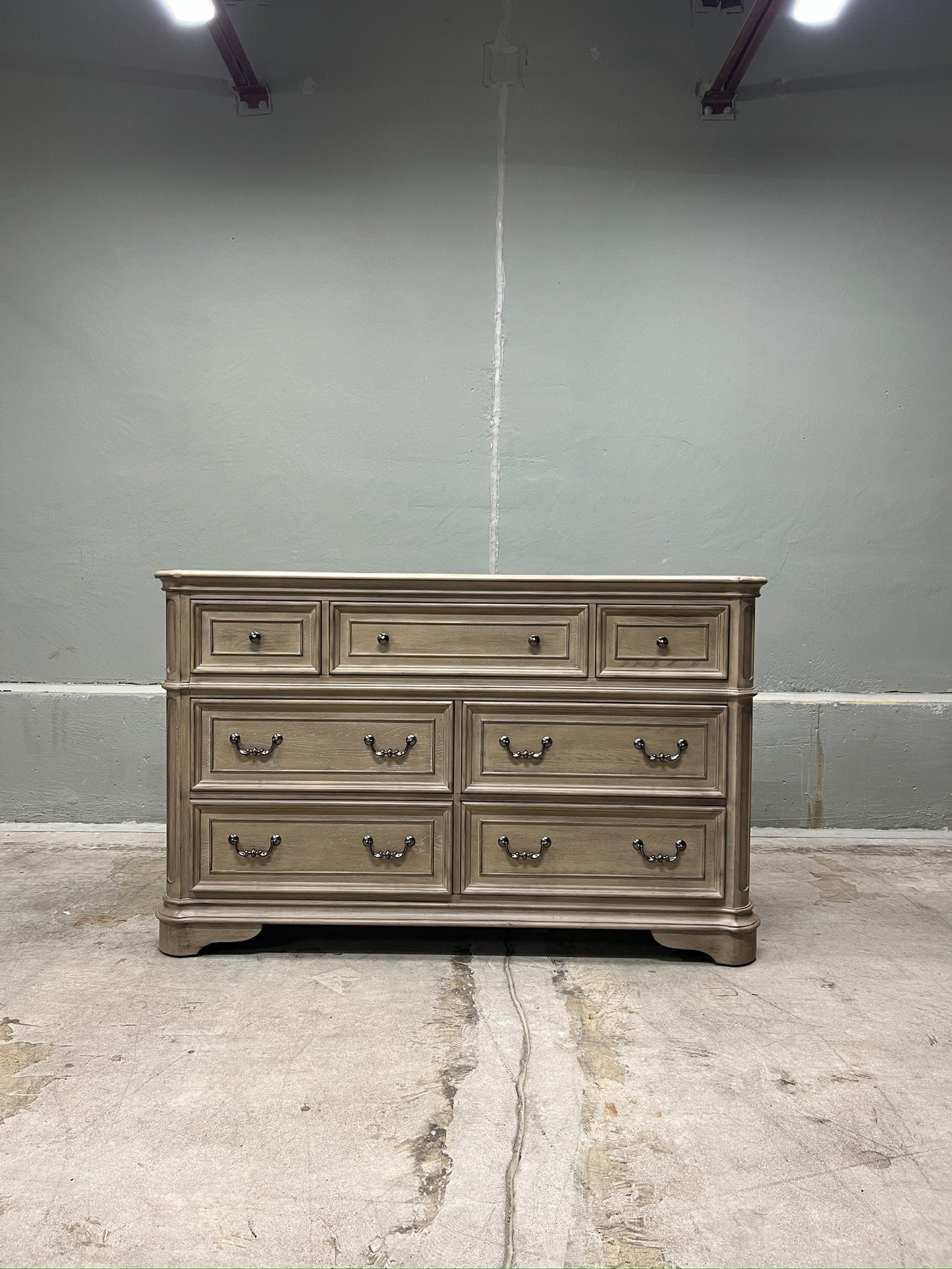 High-end traditional 7 drawer dresser with a soft weathered bisque finish